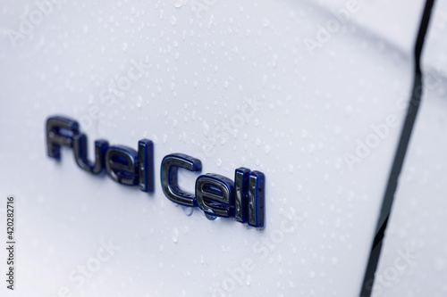 a modern car with a fuel cell sign