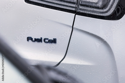 a modern car with a fuel cell sign