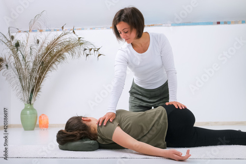 Teenager getting Shiatsu massage from Shiatsu masseuse