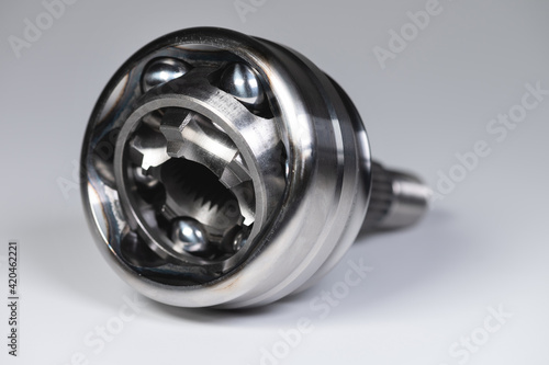 Close-up constant-velocity universal spheric joint new on gray background