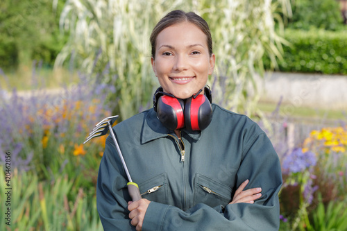 picture of female landscaper holding tool