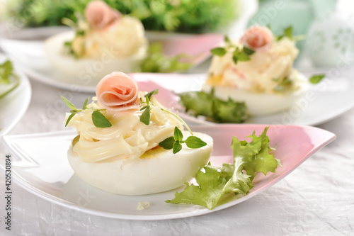 eggs with mayonnaise stuffed with vegetable salad on Easter table