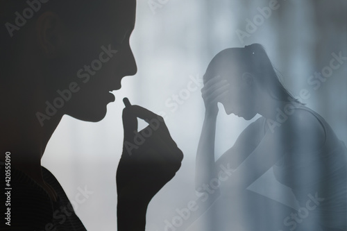 Woman swallowing medication pill. People drug addiction, sickness and mental depression concept. 