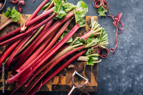 Chopped fresh rhubarb on Blue background. Top view. Free copy space