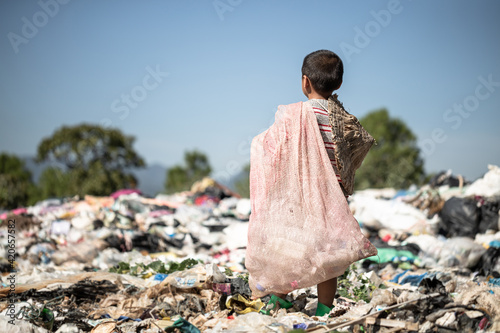 Poor children collect garbage for sale because of poverty, Junk recycle, Child labor, Poverty concept, human trafficking, World Environment Day,