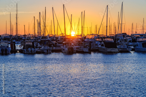 Sunset over the Hillarys marina full of mooring boats - Perth, WA, Australia