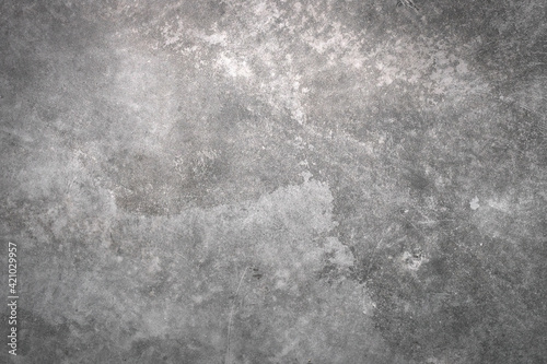 abstract pattern of grainy surface. weathered and uneven gray wall with gradient