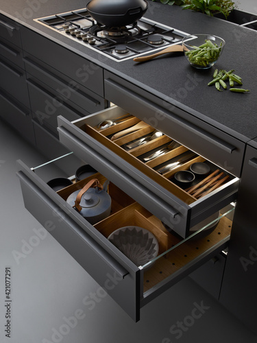 Modern kitchen, Open drawers, Set of cutlery trays in kitchen drawer. Solid oak wood cutlery drawer inserts.