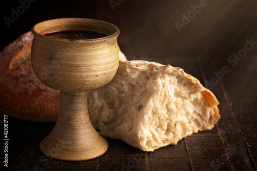 Sacrament of Holy Communion on a Dark Wooden Table