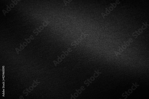 Black Canvas Polyester texture synthetical for background. Black fabric textile backdrop for interior art design or add text message.