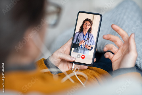 Woman doing video call with doctor