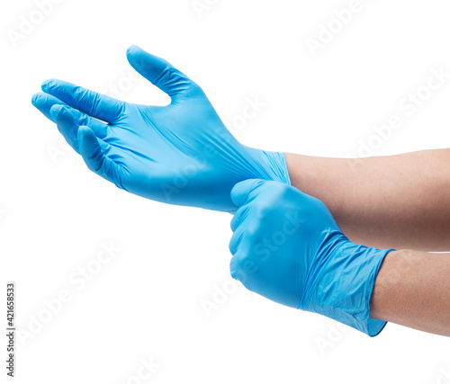 Two hands wearing nitrile gloves on a white background