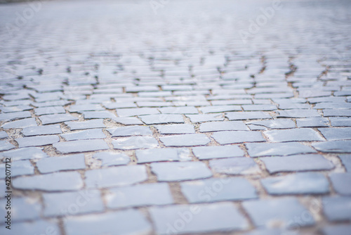 stone pavement texture, Old square stone tiles on the road and sidewalk, old style stone paving stone masonry, stone dirt road in the old town, laying slabs on the roads
