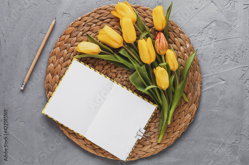 Spring mockup with yellow tulips, top view