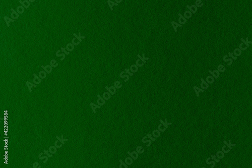 Dark green artistic paper background with gradient. Elegant layout for graphics and design