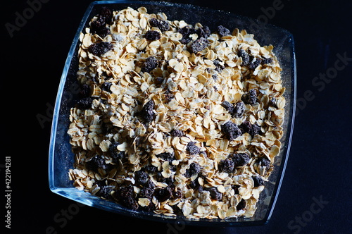 Oatmeal with raisins, cinnamon and milk. Food for athletes, vegetarians and dieters.