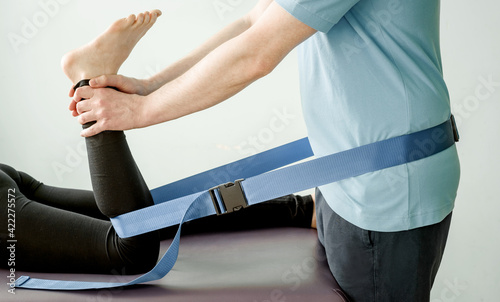 Physical therapy treatment using mulligan mobilisation belt, joint mobilisation and pain treatment