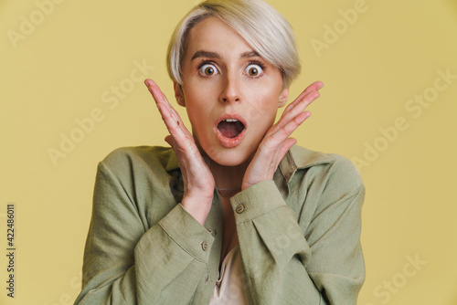 Young white-haired woman expressing surprise at camera