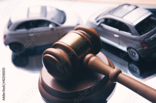 Model of car and gavel. Accident lawsuit or insurance, court case.