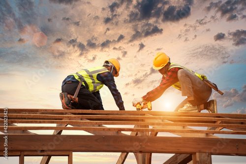 Wood workers work as a team Construction of wood structures Roofer, Two roofer carpenter working on roof structure