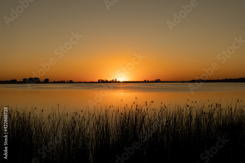 sunset on an orange lake 