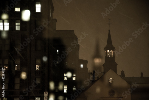 A church spire in Old Québec City, Canada, on a snowy winter night