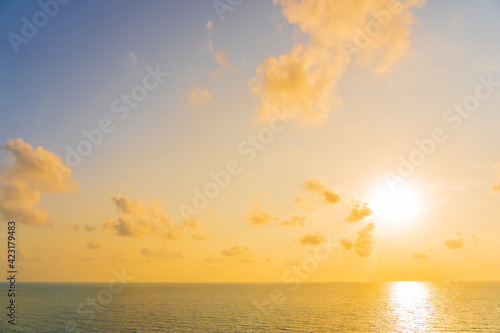 Beautiful tropical beach sea ocean with cloud and sky at sunset or sunrise time