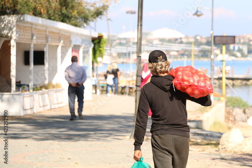 the man who takes a sack of onions and goes home. selective focus