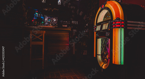 Retro jukebox on dark background in bar