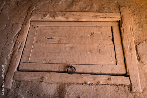 ancient wooden closed trapdoor in a rustic house