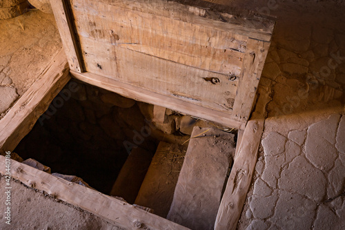 ancient wooden open trapdoor in a rustic house