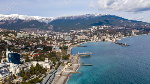 Flying over the Yalta embankment on a Sunny day.