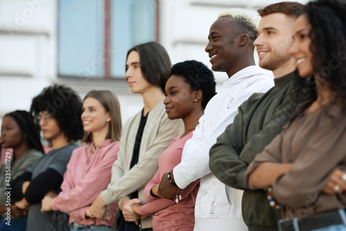 Multiethnic activists having strike, feeling excited and invincible