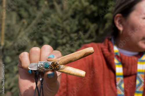 hand holding tobacco pipe snuff ancestral medicine