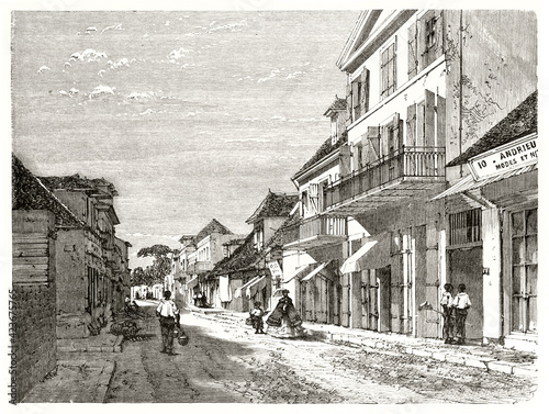 low houses line in Rue de l'Eglise (Church street), Saint-Denis, Reunion island. Ancient grey tone etching style art by Therond, Le Tour du Monde, 1862