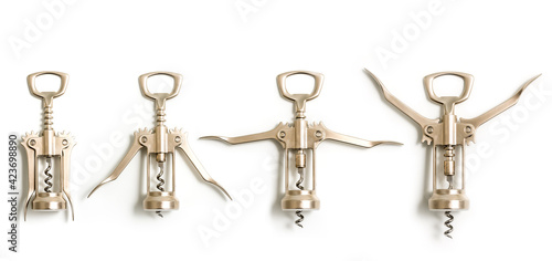 Set of four levels of shiny Stainless steel wine bottle openers on a white background