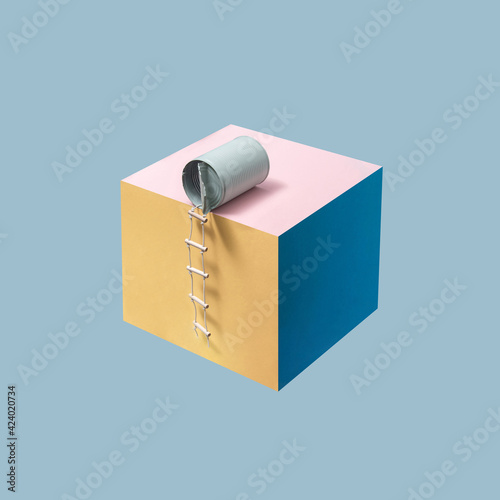 Pastel blue can with attached pilot ladder placed on a cube against blue background. Minimalistic concept. Square