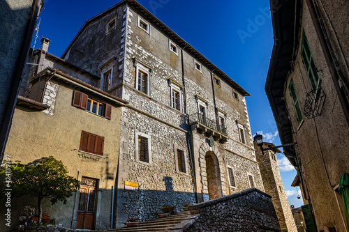The small medieval village of Capranica Prenestina in Lazio, province of Rome. The imposing Palazzo Barberini, with the staircase and the large arched entrance. The brick and stone facade.