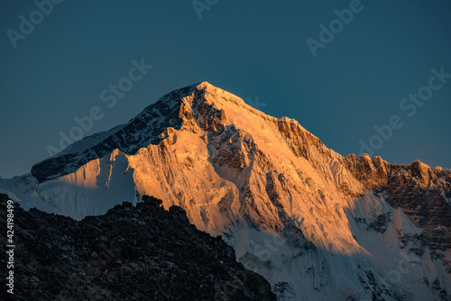 The light of sunrise on the snow mountains of Himalayas in Nepal