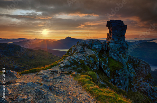 sunrise at the the distinctive rocky summit of Beinn Arthur, also known as The Cobbler, a popular mountain for climbing in the Arrochar Alps range of Argyll in the West Highlands of Scotland.