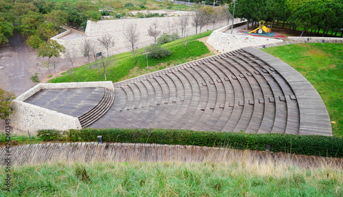 external amphitheater with stone stairways and garden