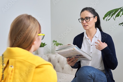 Female teacher teaching individually, lesson for preteen girl