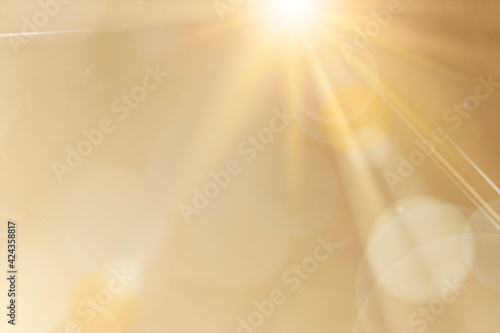 Natural light lens flare on gold background sun ray effect