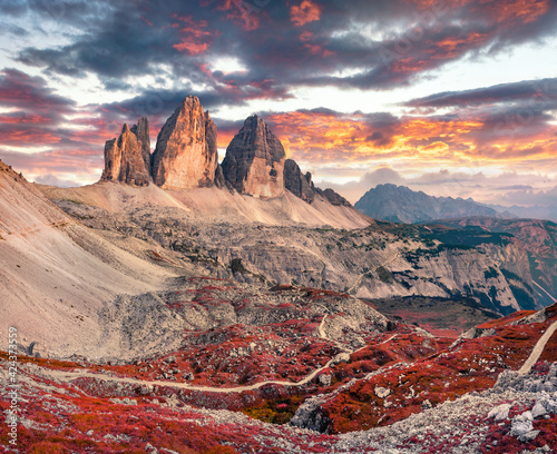 Wonderful evening view of Tre Cime Di Lavaredo mpountain peaks. Gorgeous autumn scene of Dolomite Alps, South Tyrol, Italy, Europe. Beauty of nature concept background.