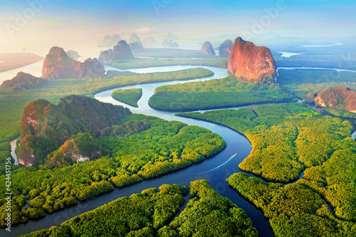 Aerial view of Phang Nga bay with mountains at sunrise in Thailand.
