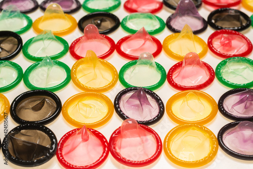 Colorful condoms background.