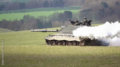 a british army Challenger II main battle tank creating a thick white smoke screen whilst on maneuvers, Salisbury Plain