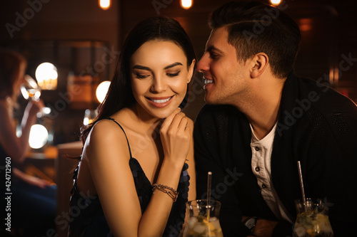 Man and woman flirting with each other in bar