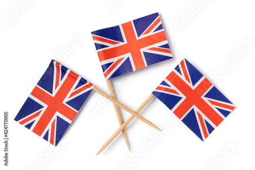 Traditional miniature British flag cocktail sticks isolated on white background close up 