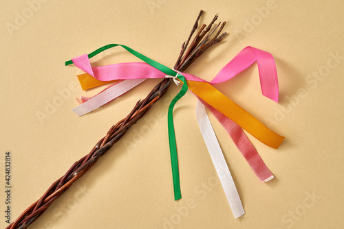 Pomlazka - traditional Czech symbol of spring, on yellow paper background